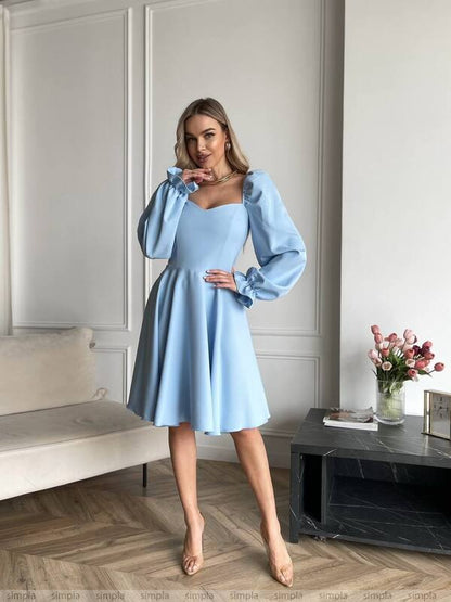 Elegant Light Blue Fitted Dress with Flared Skirt