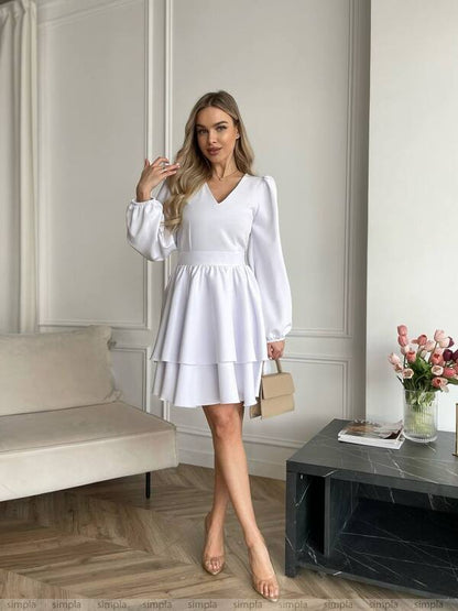 Elegant White Dress with Bell Sleeves and Tiered Skirt for Chic Occasions