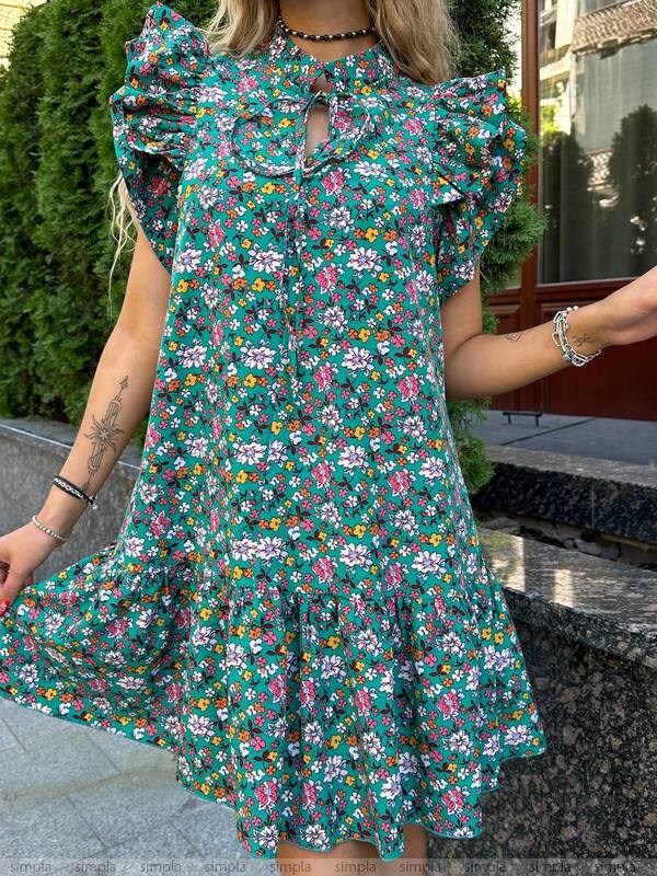 Woman wearing a floral dress with a blurred background