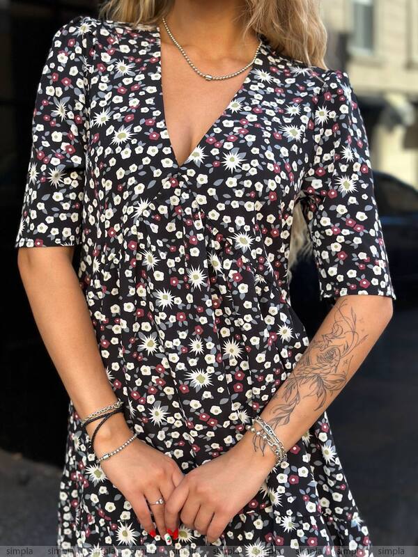 Woman wearing a floral dress with a blurred background