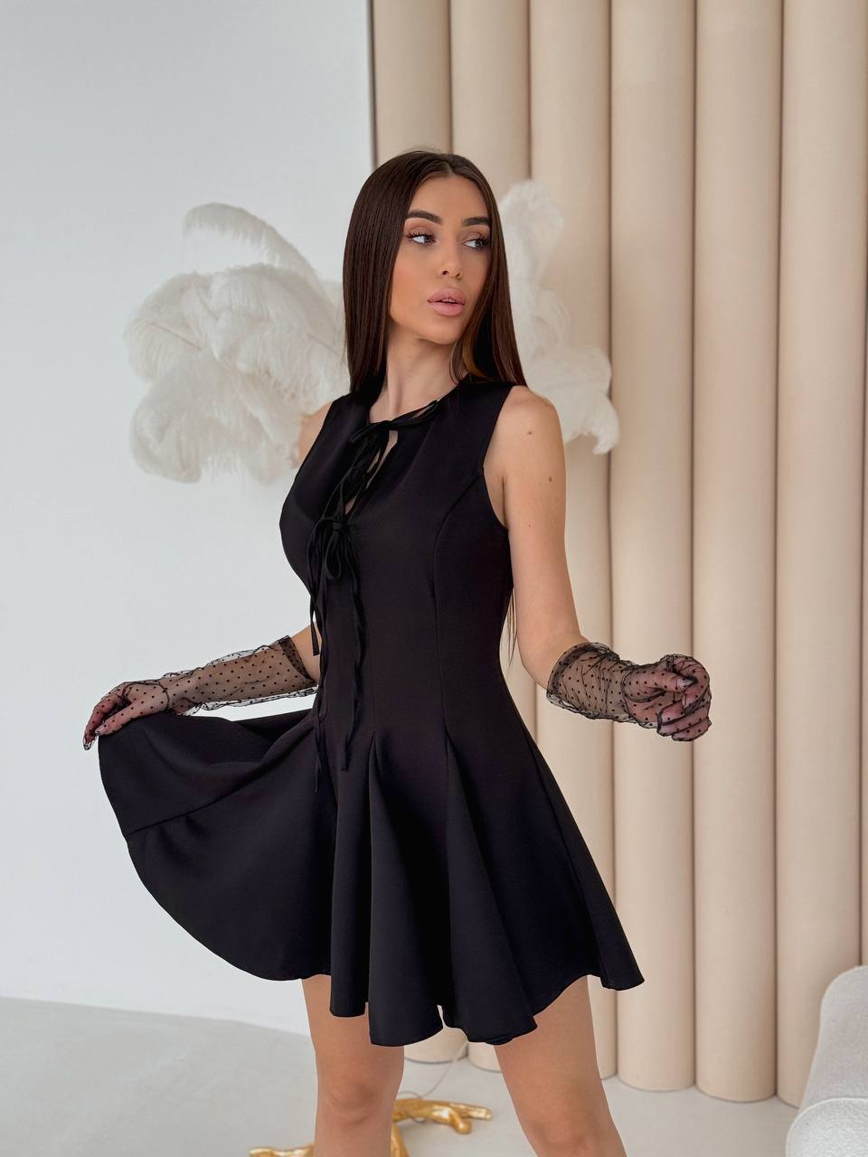 Elegant Black Sleeveless Dress with Flared Skirt