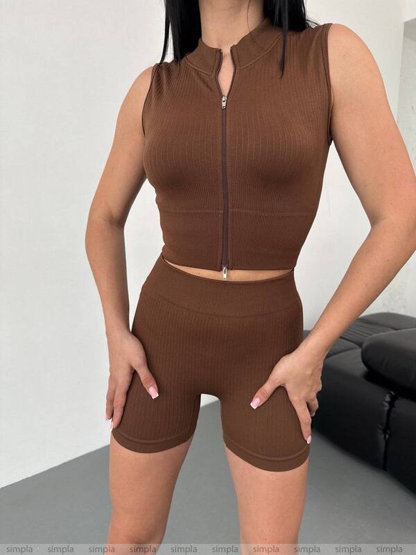 Brown sleeveless top and shorts set worn by a person on a neutral background