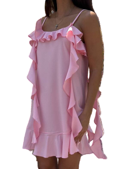 Pink ruffled dress worn by a person on a white background