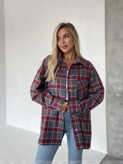 Woman wearing a plaid shirt with a neutral background