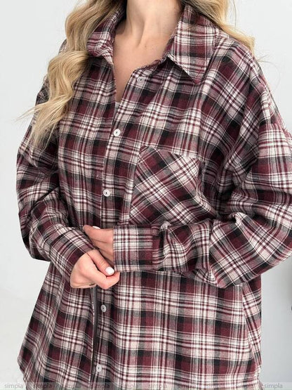 Plaid shirt worn by a person on a white background