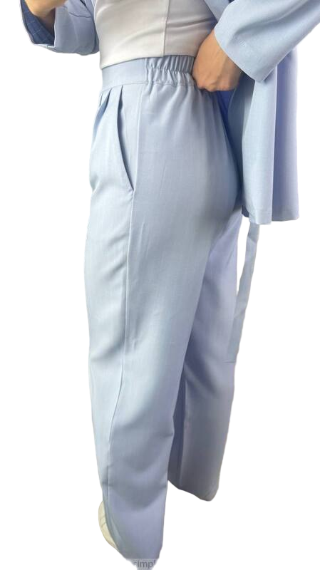 Person wearing a light blue outfit with a white background