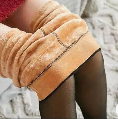 Close-up of a person wearing a beige knee-high sock with a textured finish.