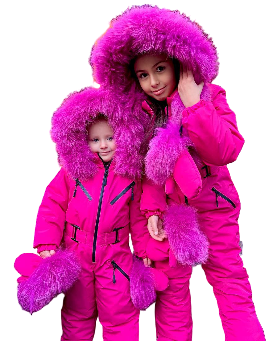 Two children wearing bright pink snowsuits with fur hoods on a white background