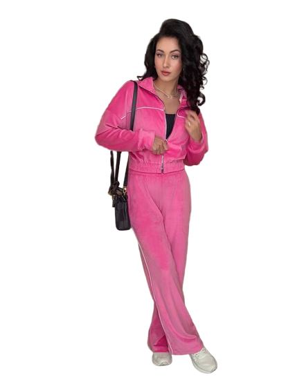 Woman wearing a pink tracksuit with a white background