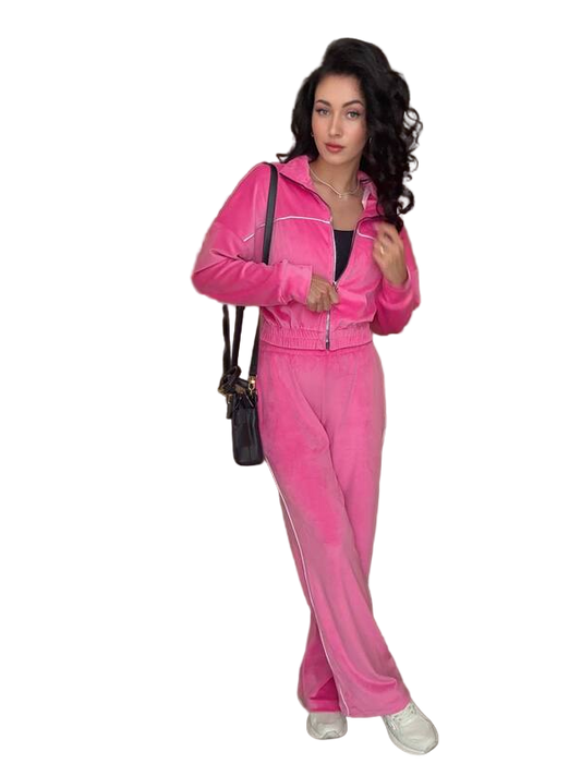 Woman wearing a pink tracksuit with a white background