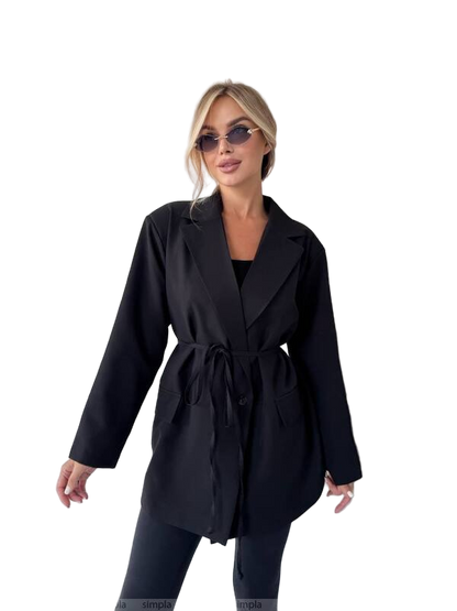 Woman wearing a black coat on a white background