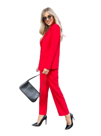 Woman in a red suit holding a black handbag on a white background
