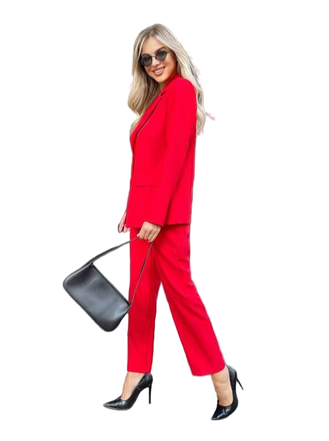 Woman in a red suit holding a black handbag on a white background
