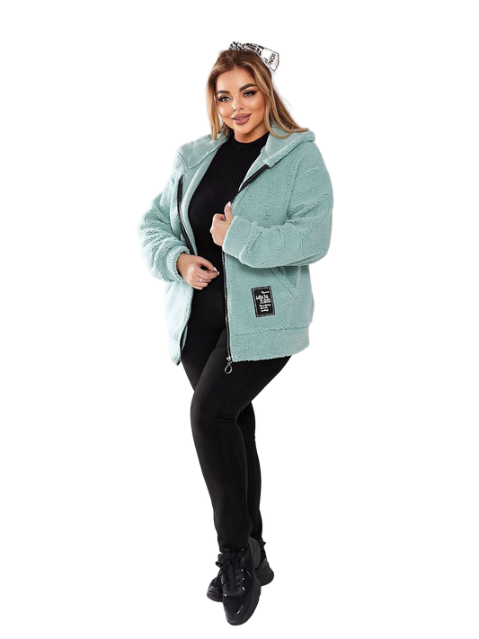 Woman wearing a light blue fleece jacket on a white background