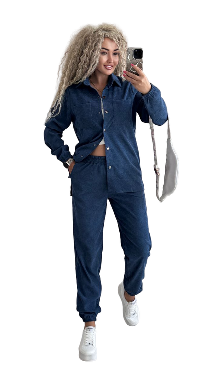 Woman taking a selfie wearing a blue tracksuit on a white background