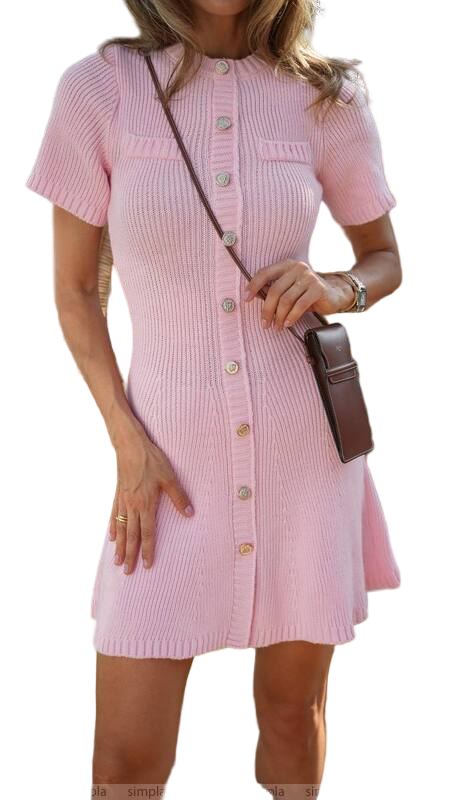 Woman wearing a pink dress with a brown bag on a white background