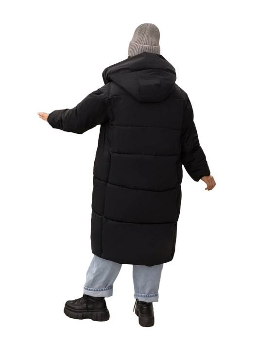 Person wearing a long black puffer coat on a white background