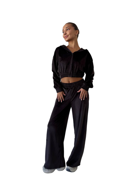 Woman wearing a black outfit on a white background